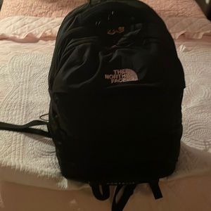Black rose gold north face backpack
